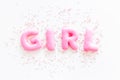 Girl word as decoration for baby shower on white background top view