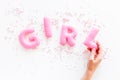 Girl word as decoration for baby shower on white background top view