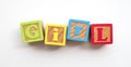 Girl word made from colourful wooden baby development blocks