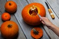 Girl worked on wooden table with pampkin for halloween