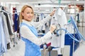 Girl worker Laundry ironed clothes Royalty Free Stock Photo