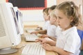 Girl working on a computer at primary school Royalty Free Stock Photo