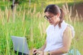 Girl working on her laptop computer outside Royalty Free Stock Photo