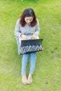 Girl working on her laptop computer outside Royalty Free Stock Photo