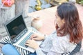 Girl working on her laptop computer outside Royalty Free Stock Photo