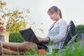 Girl working on her laptop computer outside Royalty Free Stock Photo