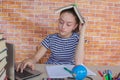 Girl working on his homework. young attractive student Girl studying lessons Royalty Free Stock Photo