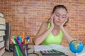 Girl working on his homework. young attractive student Girl studying lessons Royalty Free Stock Photo