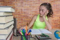 Girl working on his homework. young attractive student Girl studying lessons Royalty Free Stock Photo