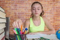 Girl working on his homework. young attractive student Girl studying lessons Royalty Free Stock Photo