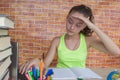 Girl working on his homework. young attractive student Girl studying lessons Royalty Free Stock Photo