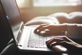 Girl working at home office hand on keyboard close up