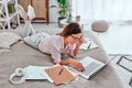 Girl working at home, woman typing on laptop, laptop on bed Royalty Free Stock Photo