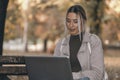 Girl working at a laptop in the park Royalty Free Stock Photo