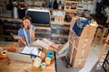 Girl working with laptop ready to open their cafe Royalty Free Stock Photo