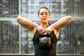 Girl working out with a kettlebell weight