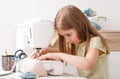 Girl working with sewing machine Royalty Free Stock Photo