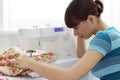 The girl works on sewing machine Royalty Free Stock Photo