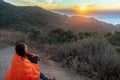 Girl Wrapped in Blanket while watching sunset Royalty Free Stock Photo