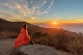 Girl Wrapped in Blanket while watching sunset