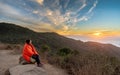 Girl Wrapped in Blanket while watching sunset Royalty Free Stock Photo