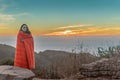 Girl Wrapped in Blanket while watching sunset Royalty Free Stock Photo