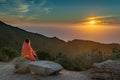 Girl Wrapped in Blanket while watching sunset Royalty Free Stock Photo