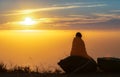 Girl Wrapped in Blanket while watching sunset Royalty Free Stock Photo