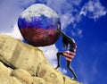 The girl, wrapped in the flag of the United States of America, raises a stone to the top in the form of the silhouette of the flag