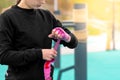 Girl wrapping a wrist wrap around her hand before outdoor martial arts training Royalty Free Stock Photo