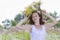 Girl in a wreath of field-flowers Royalty Free Stock Photo