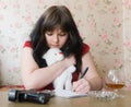 Girl writes a farewell letter Royalty Free Stock Photo