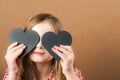 The girl writes a love message on Valentine`s Day. Baby with heart close-up and copy space