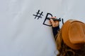 The girl writes marker on wall