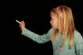 Girl writing on blackboard