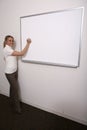 Girl writing on full whiteboard Royalty Free Stock Photo