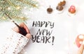 Girl writing Happy new year calligraphy card Royalty Free Stock Photo