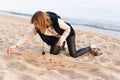 Girl Writing New Year in Sand Royalty Free Stock Photo