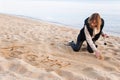 Girl Writing New Year in Sand Royalty Free Stock Photo