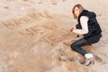 Girl Writing New Year in Sand Royalty Free Stock Photo