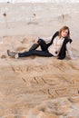 Girl Writing New Year in Sand Royalty Free Stock Photo