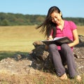 Girl Writing in Note Book