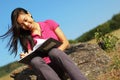 Girl Writing in Note Book