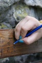 Girl writing on wood bench Royalty Free Stock Photo