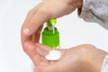Girl& x27;s fingers press on the dispenser, cleanser, skin care product, liquid hand soap