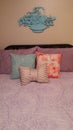 A girl& x27;s room bedding with pillows