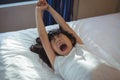 Girl yawning on bed in the bed room Royalty Free Stock Photo