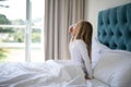 Girl yawning while waking up n bed Royalty Free Stock Photo