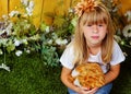 Girl 6 years old in the garden with toy