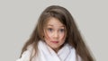Surprised girl in a white coat Royalty Free Stock Photo